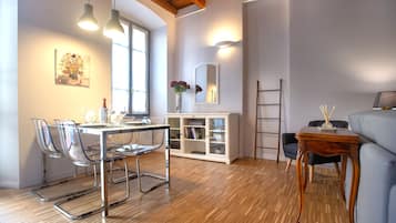 Deluxe Apartment, City View | Living room | Flat-screen TV