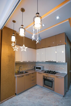 Apartment | Private kitchenette | Fridge, microwave, oven, stovetop - HostHub Studio Apartment in the center (Tbilisi)
