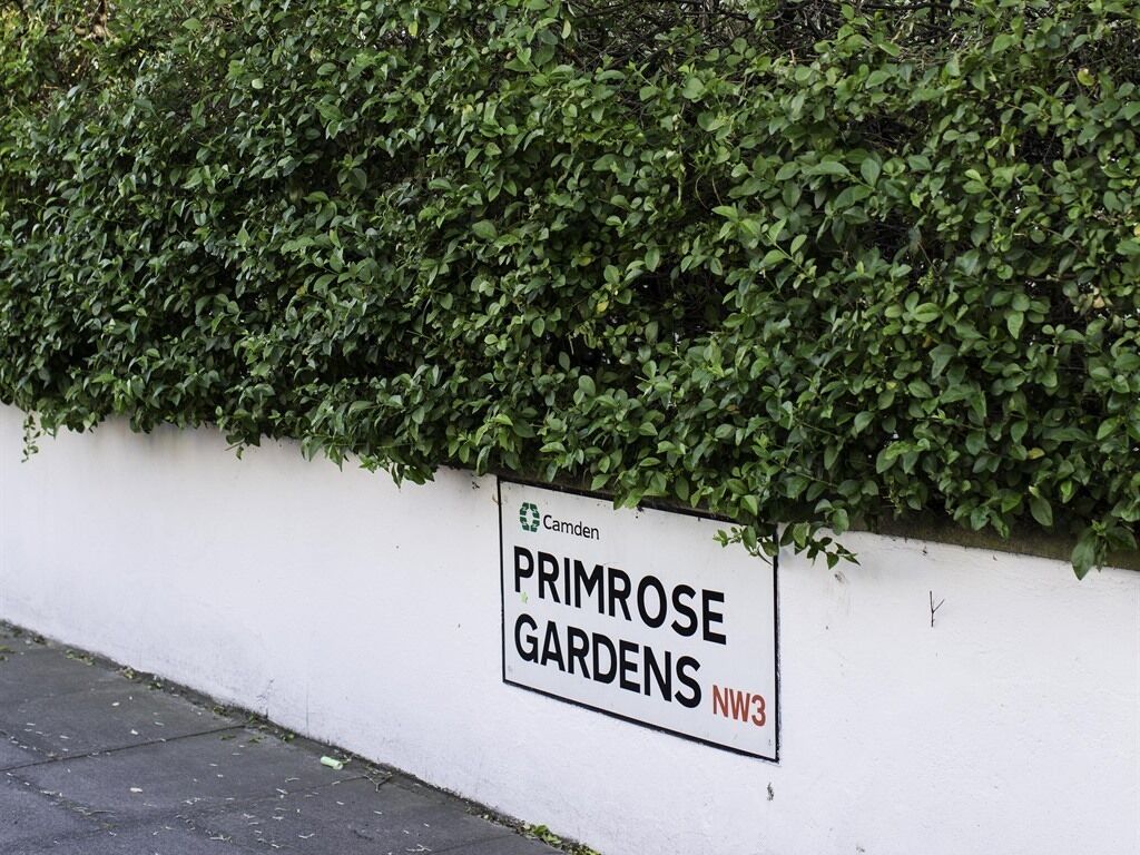 A sign for Primrose Gardens NW3, indicating a location.
