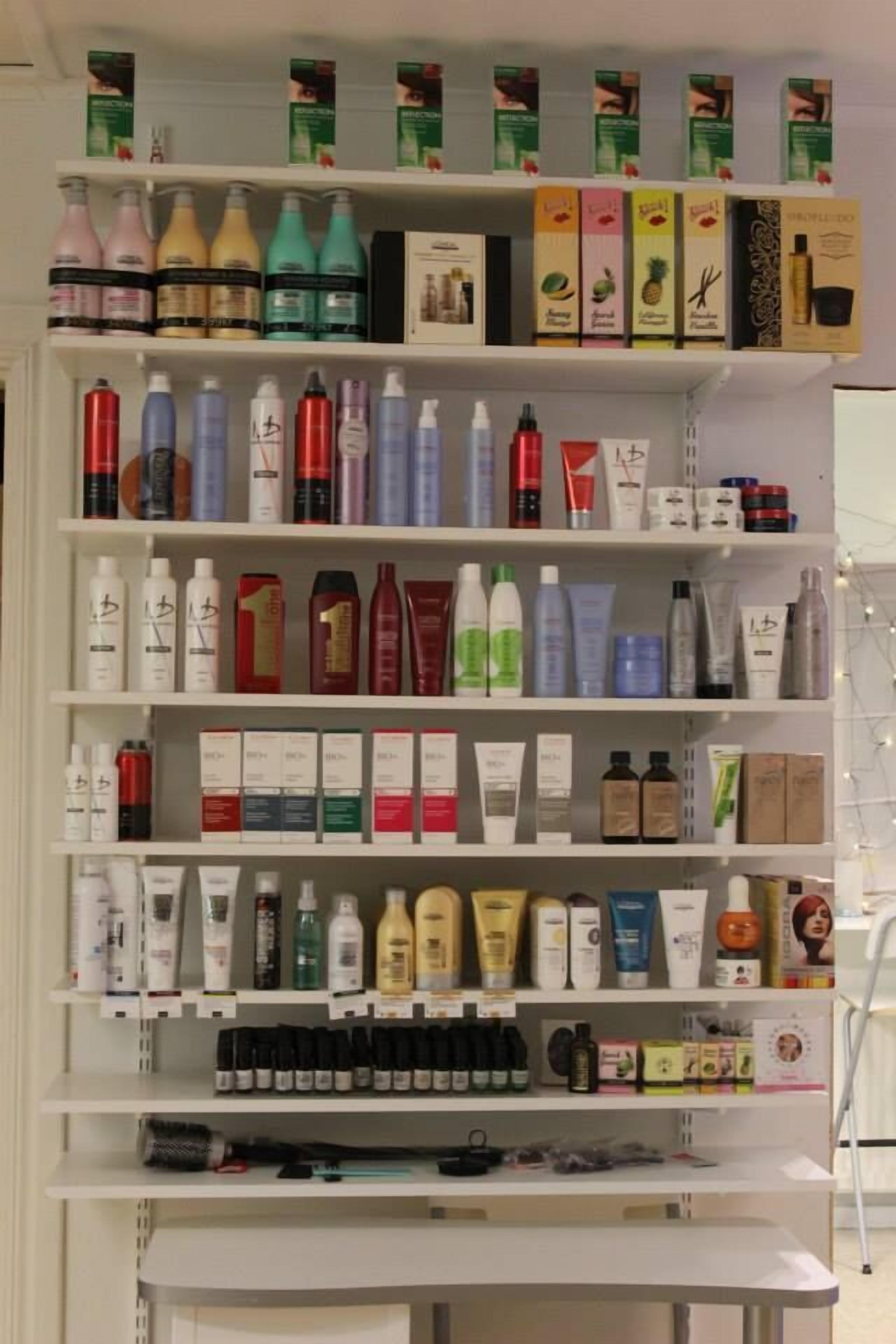 A neatly organized shelf with various personal care products.