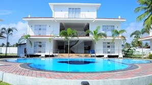 A modern two-story house with a swimming pool, a covered outdoor area, and a staircase leading to the upper floor. - Sunstar Nilaveli (Nilaveli)