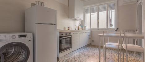 Apartment, 2 Bedrooms | Private kitchen | Full-size fridge, microwave, stovetop, coffee/tea maker