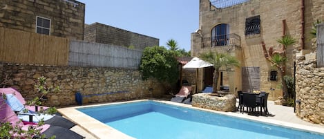 Seasonal outdoor pool, pool umbrellas, pool loungers