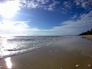 On the beach, white sand, beach umbrellas - Sea of Tranquility (Ilhéus)