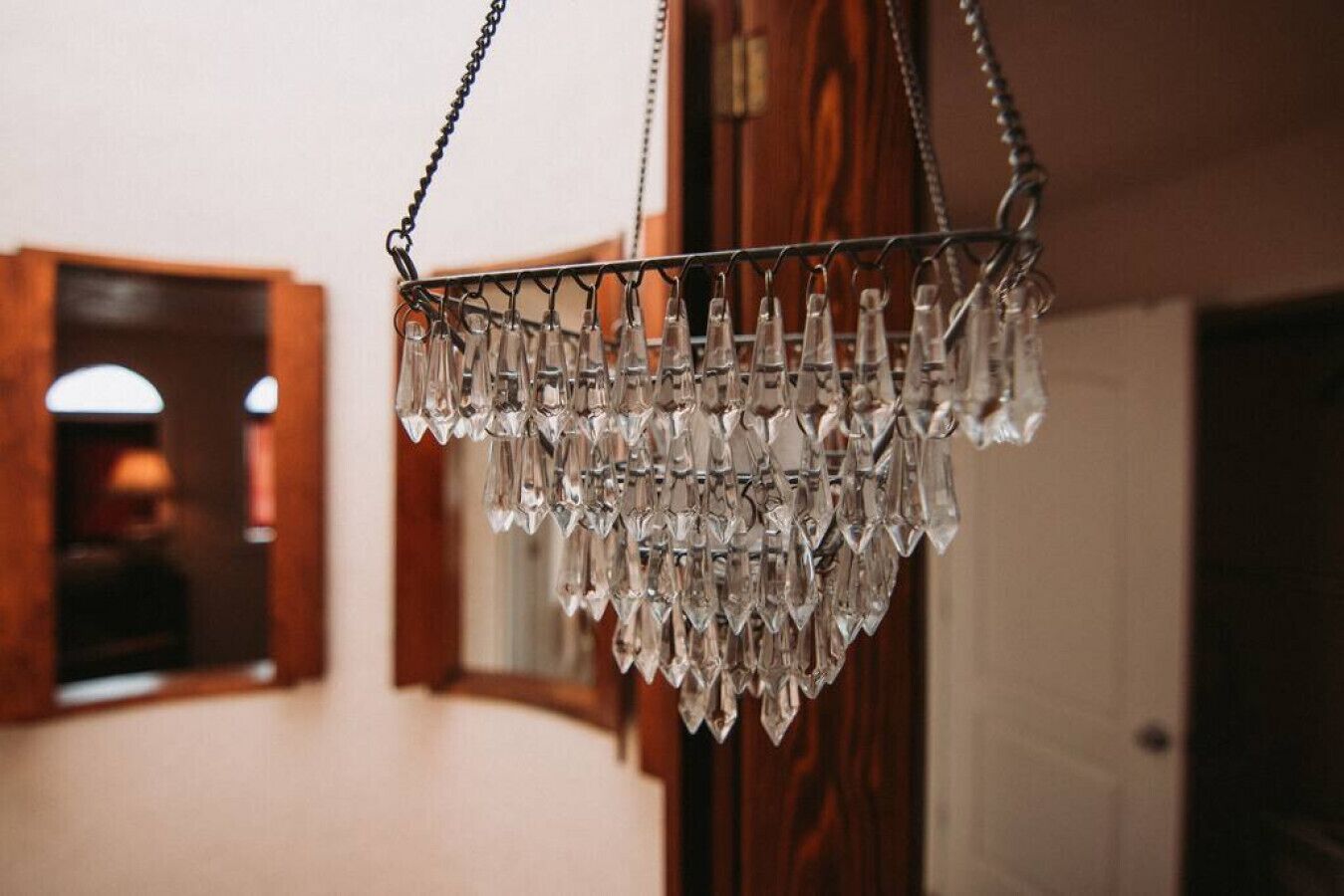A chandelier with multiple crystal pendants hanging from a metal frame.
