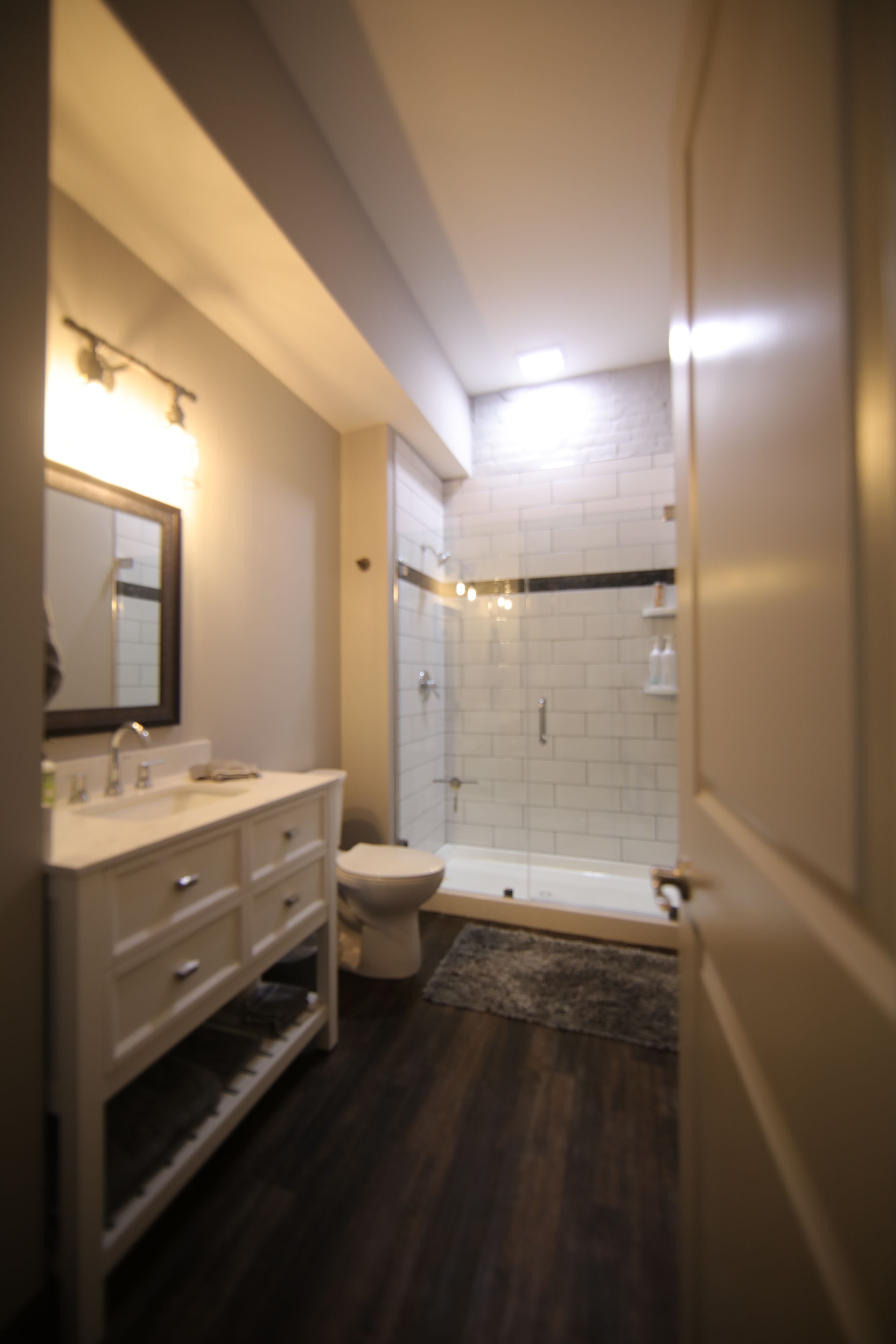 signature studio suite, 1 king bed, non smoking, city view | bathroom | shower, hair dryer, towels