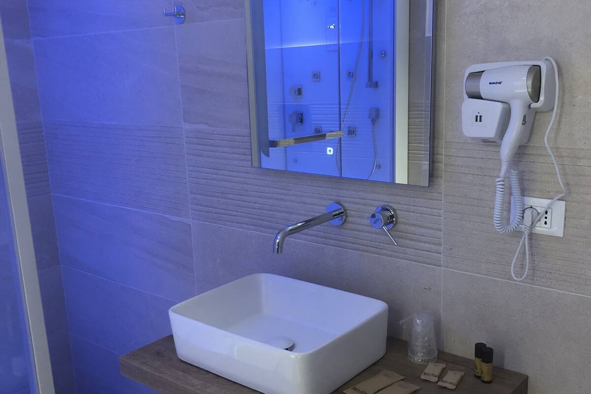 superior room, 1 king bed, pool view, poolside | bathroom | free toiletries, hair dryer, bathrobes, bidet