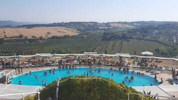 Seasonal outdoor pool, open 8:00 AM to 7:00 PM, sun loungers