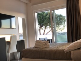 Family Triple Room, 1 Queen Bed, Balcony, Pool View | 1 bedroom, hypo-allergenic bedding, minibar, in-room safe