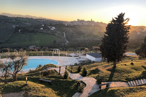 Seasonal outdoor pool, open 8:00 AM to 7:00 PM, pool loungers