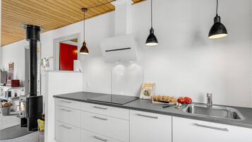 Fridge, stovetop, dishwasher, coffee/tea maker