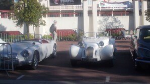 A vintage car exhibition with classic cars on display.