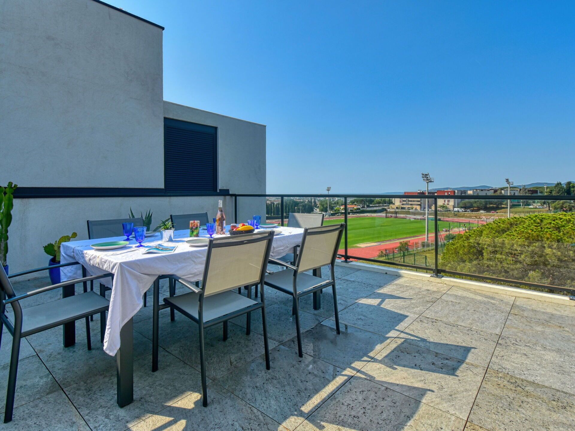 Table, Furniture, Sky, Building, Chair, Plant, Shade, Urban Design, Outdoor Furniture, Flooring