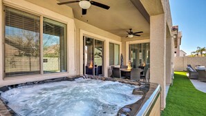 A hot tub with a patio area, including outdoor furniture and a ceiling fan. - Group Fun in Glendale! Getaway w/ Private Pool (Glendale)