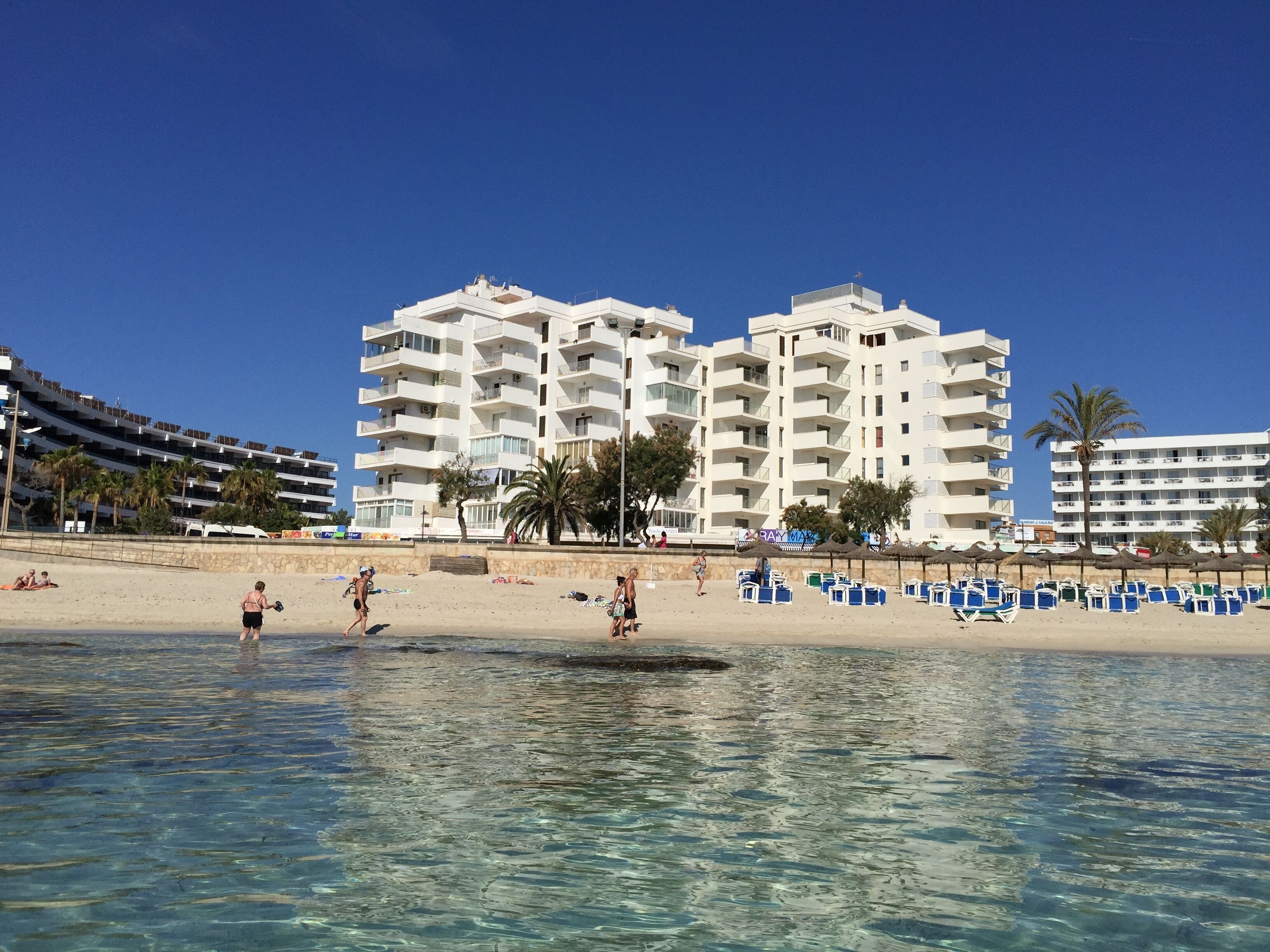 On the beach, sun loungers, beach towels