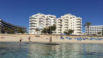 On the beach, sun loungers, beach towels