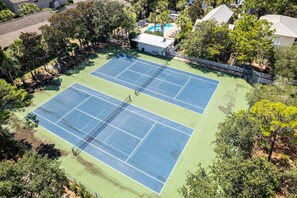 An aerial view of a tennis court complex with two courts, surrounded by trees and a pool area. - 3 min. Walk to Beach/ Seaside 2 miles/ On 30A (Santa Rosa Beach)