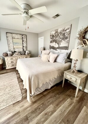 A bedroom with a bed, a nightstand, a ceiling fan, a dresser, and a rug. - 3 min. Walk to Beach/ Seaside 2 miles/ On 30A (Santa Rosa Beach)