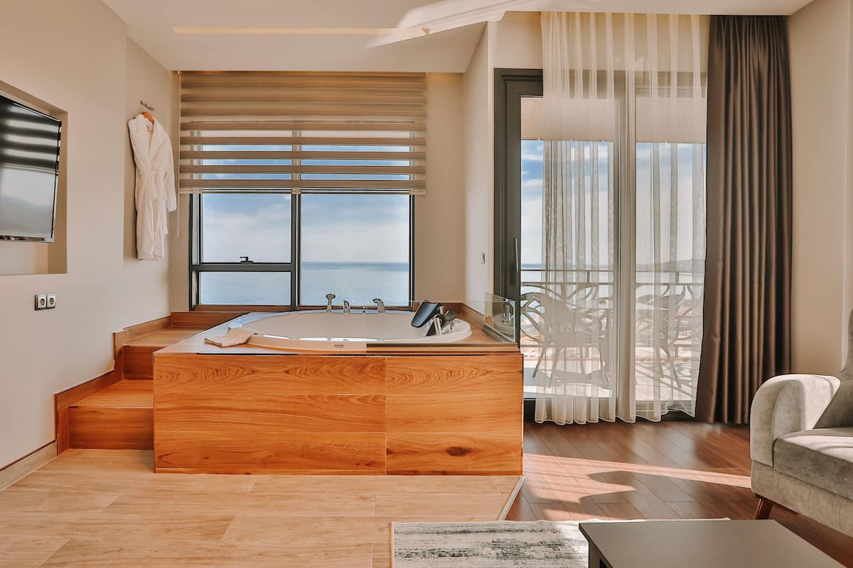 suvva suite with jacuzzi and sea view | 1 bedroom, minibar, in-room safe, blackout curtains