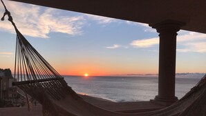 A hammock overlooking a sunset view of the ocean. - Fabulous Developers Beachfront PENTHOUSE XMAS & NY WKS @ Playa Grande Resort (Cabo San Lucas)