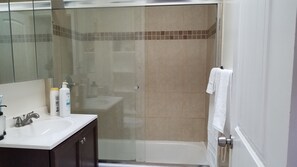 Shower, hair dryer, towels, soap