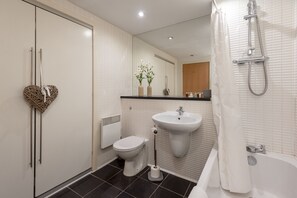 Bathtub, hair dryer, towels