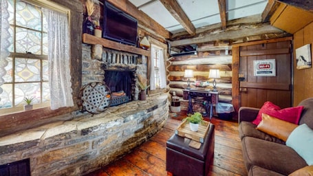 Fireplace. The Bertha's Log Cabin