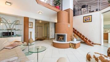 Penthouse | Living area | Flat-screen TV, fireplace, DVD player