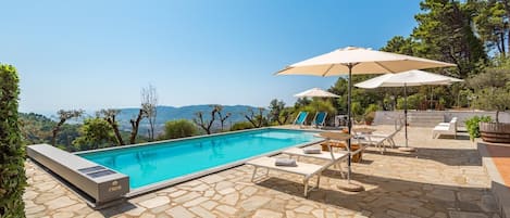 Indoor pool, outdoor pool, pool umbrellas, pool loungers