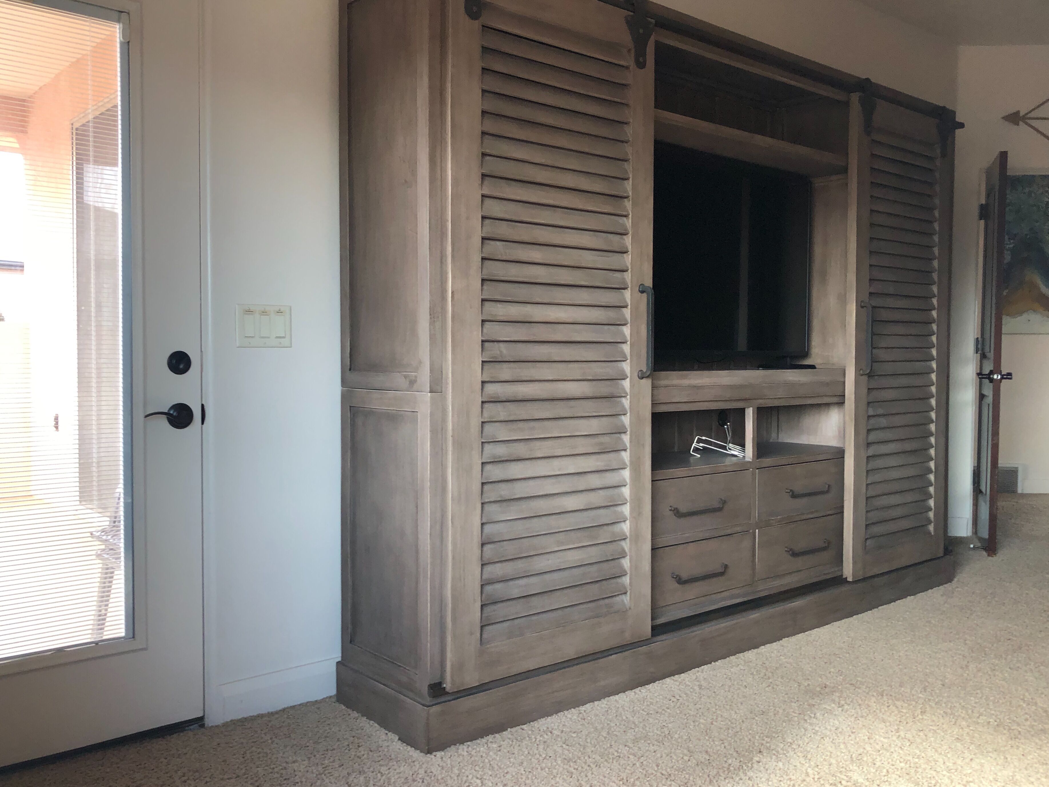 Bunk room entertainment center with storage 