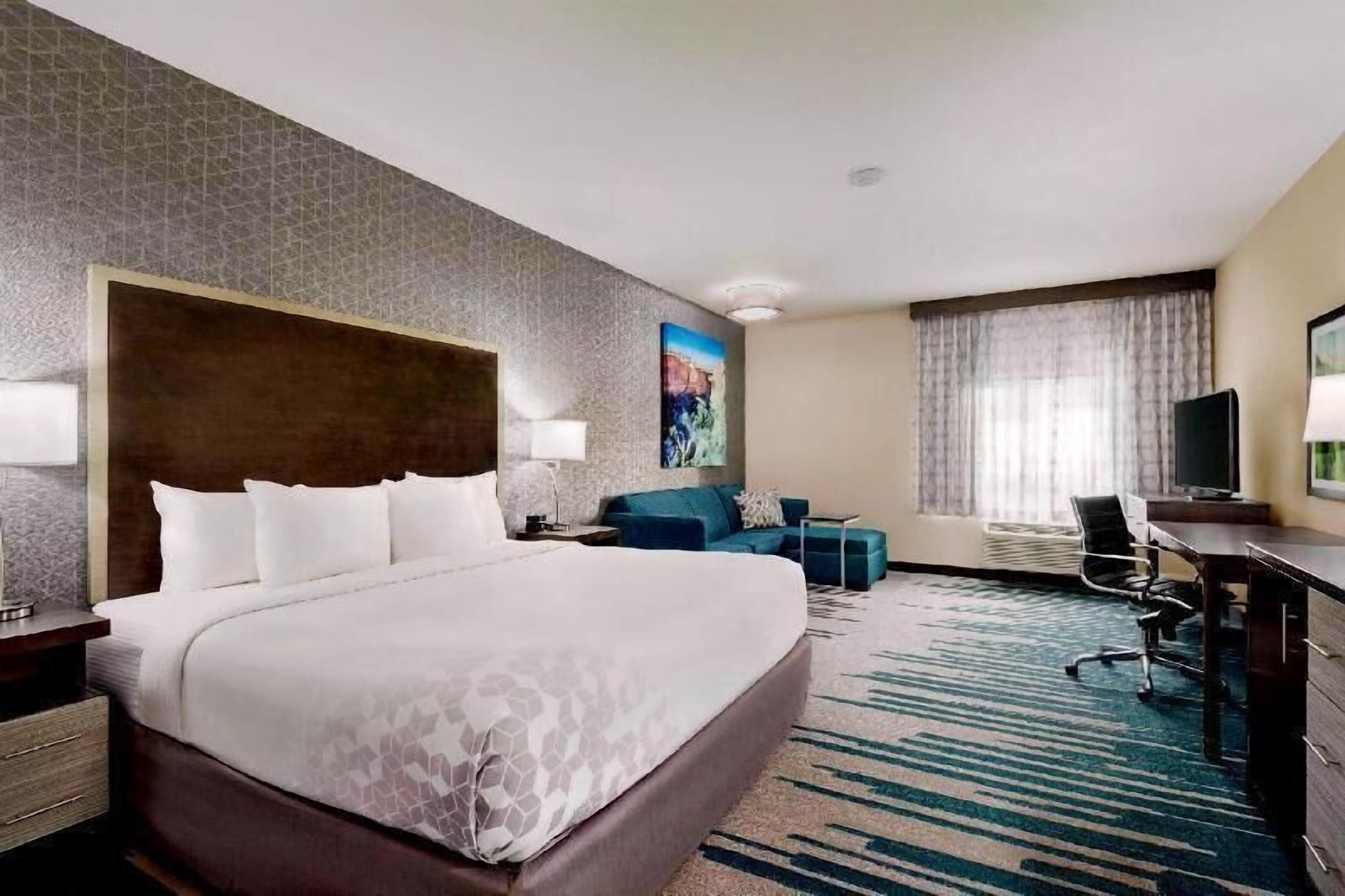Premium bedding, pillow-top beds, desk, laptop workspace