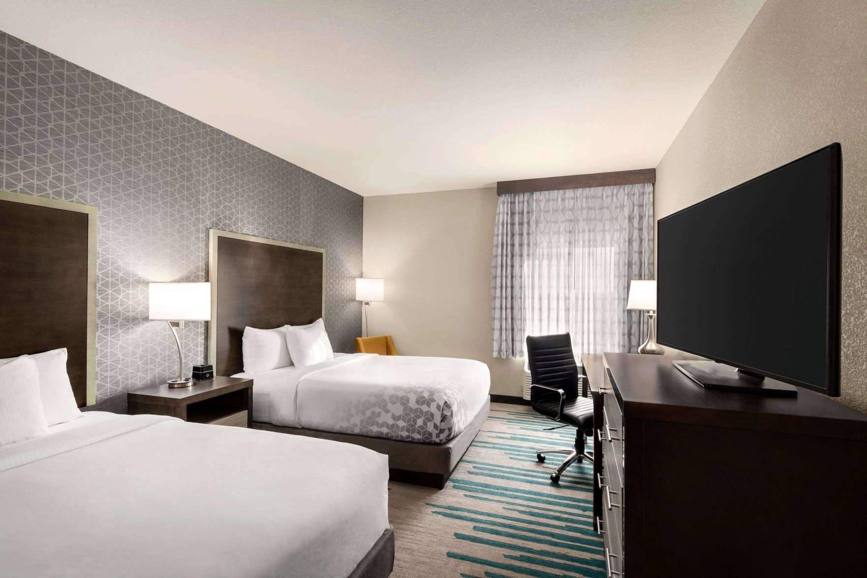 Premium bedding, pillow-top beds, desk, laptop workspace