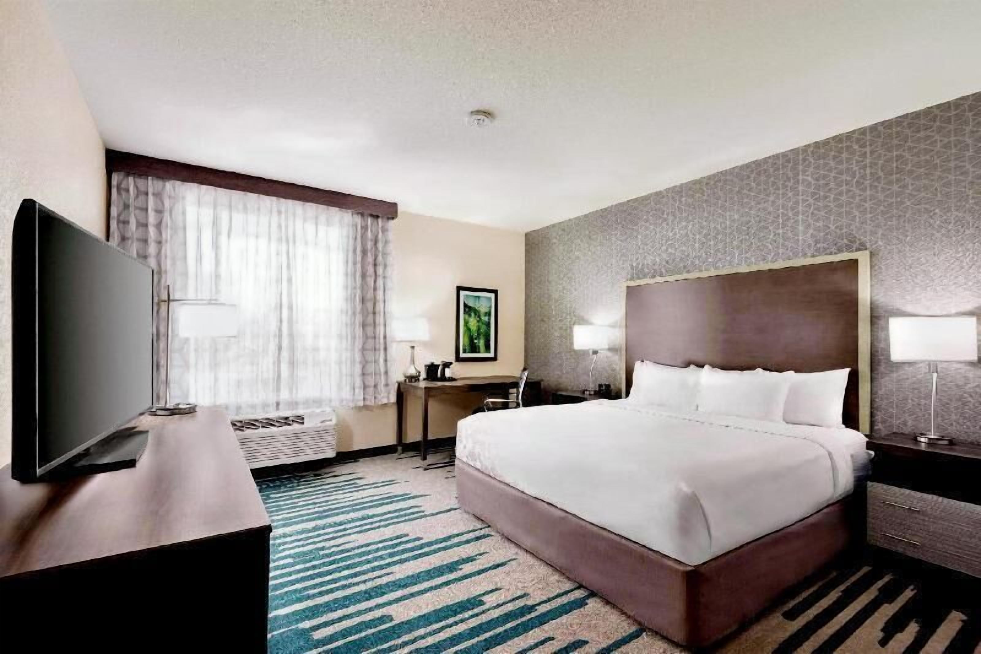 Premium bedding, pillow-top beds, desk, laptop workspace