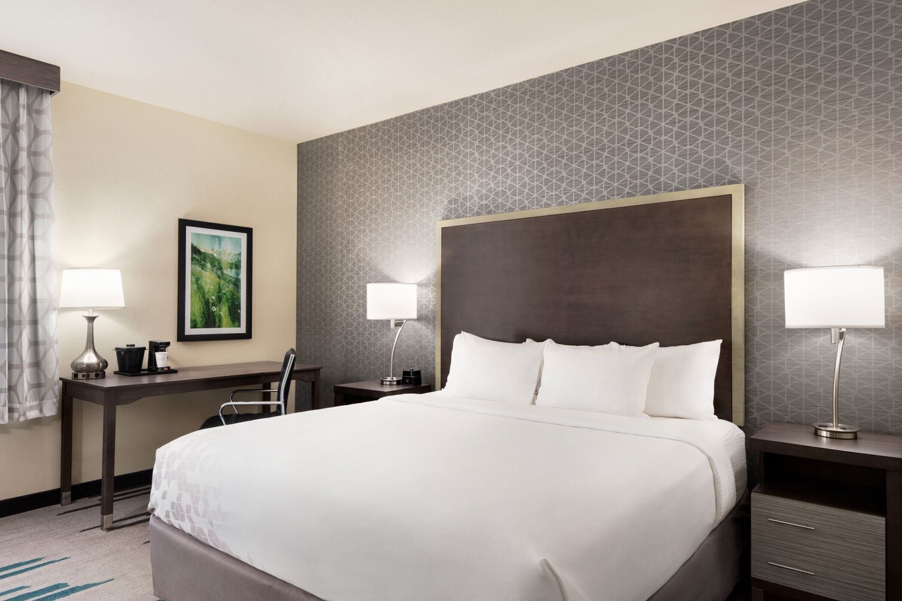 Premium bedding, pillow-top beds, desk, laptop workspace