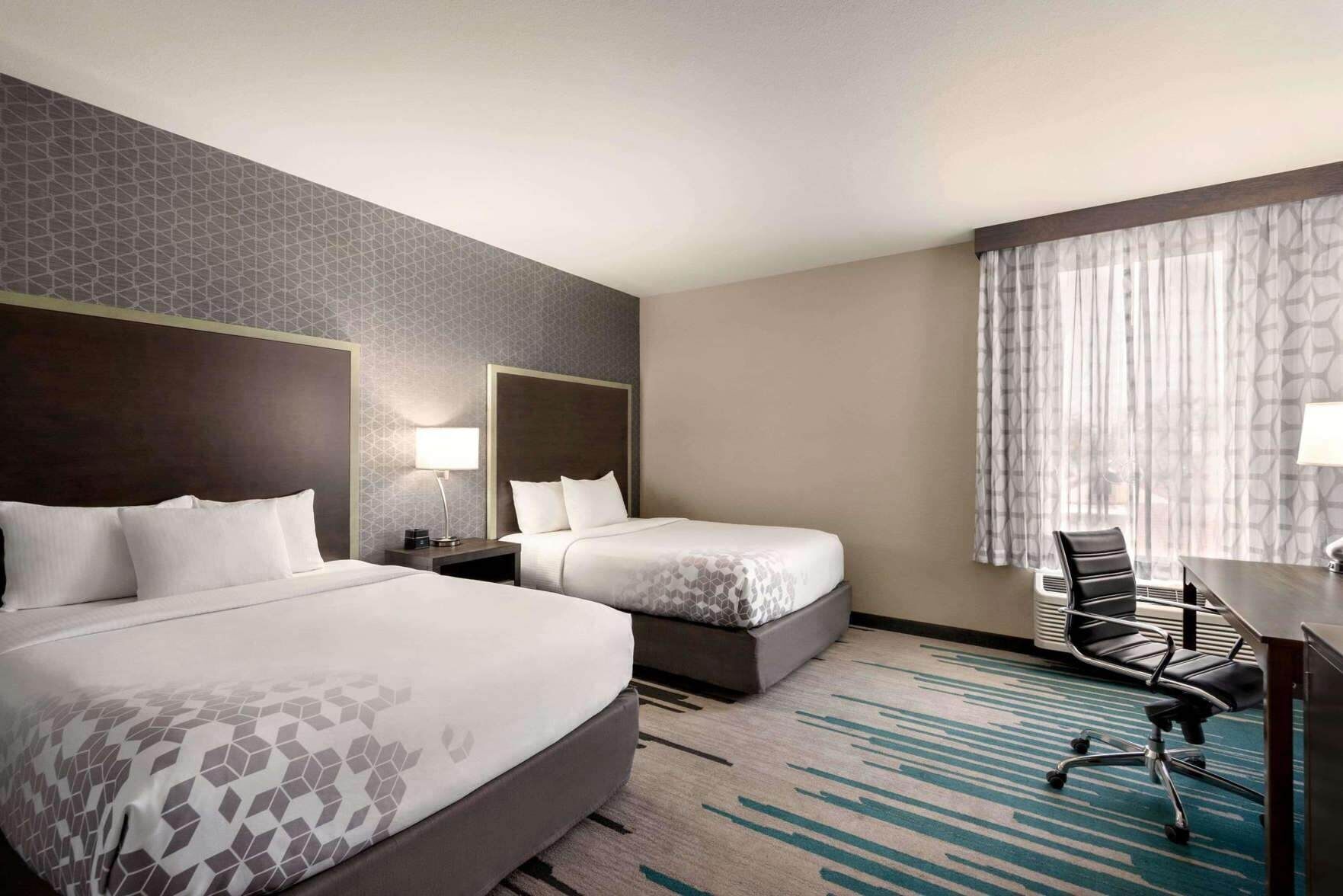 Premium bedding, pillow-top beds, desk, laptop workspace