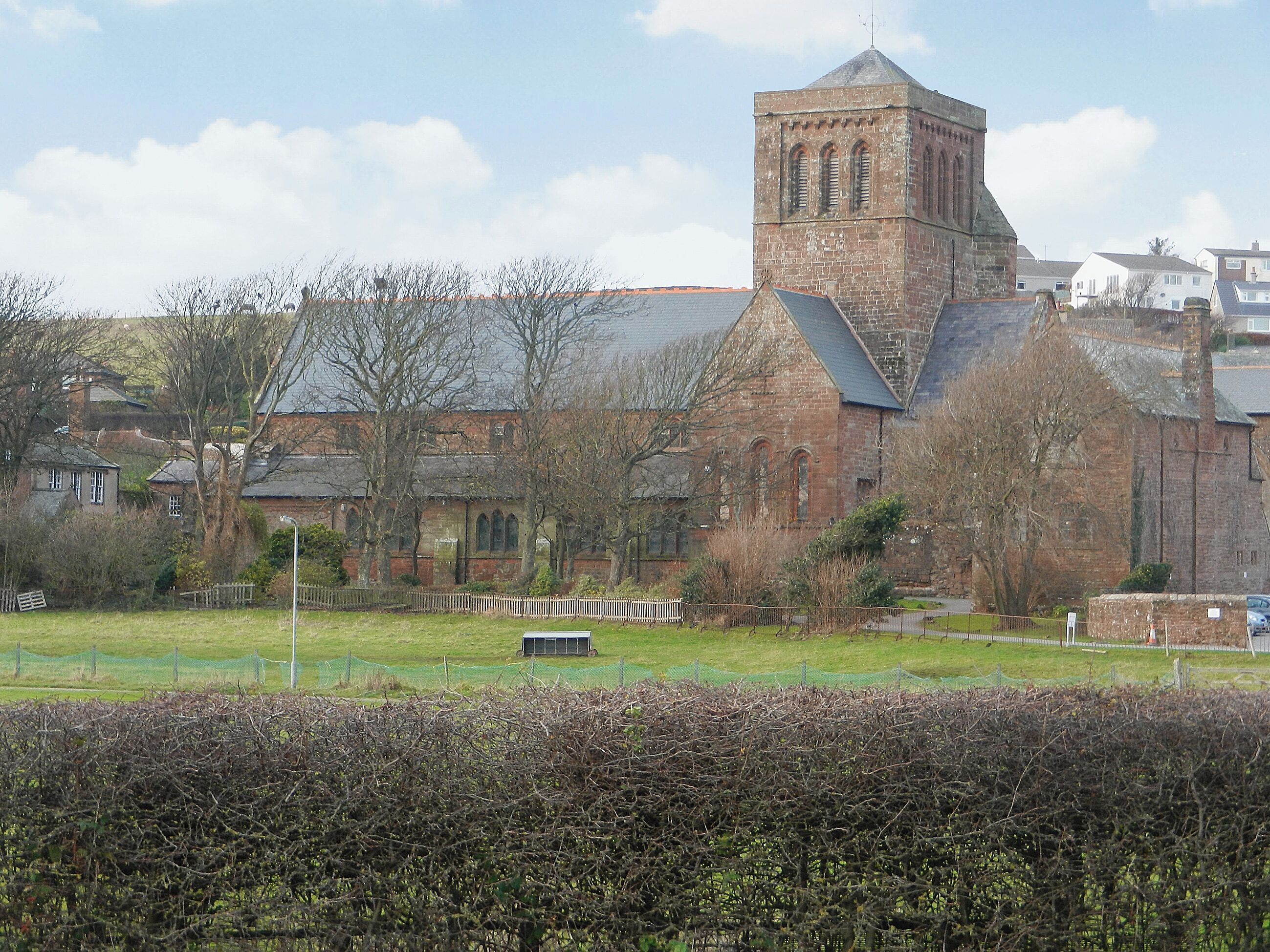 A large, historic church with a prominent tower and multiple windows.