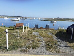 A marina with boats docked, a bench, and a car. - 2 bedroom accommodation in Wells-next-the-Sea (Wells-next-the-Sea)