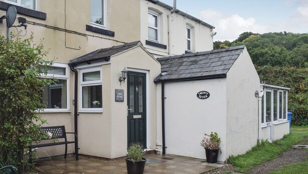 A two-story building with a sign reading "Cobb's Cottage" and "Twenty Seven" on the side. - 3 bedroom accommodation in Grosmont, near Whitby (Grosmont, near Whitby)