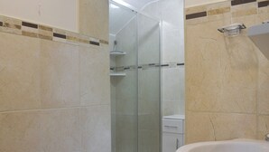 A bathroom with a glass-enclosed shower, a white sink, and a toilet. - 3 bedroom accommodation in Grosmont, near Whitby (Grosmont, near Whitby)
