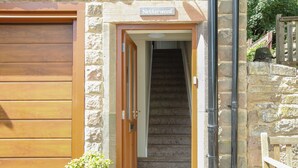 A stone building with a wooden door labeled "Notherwood."