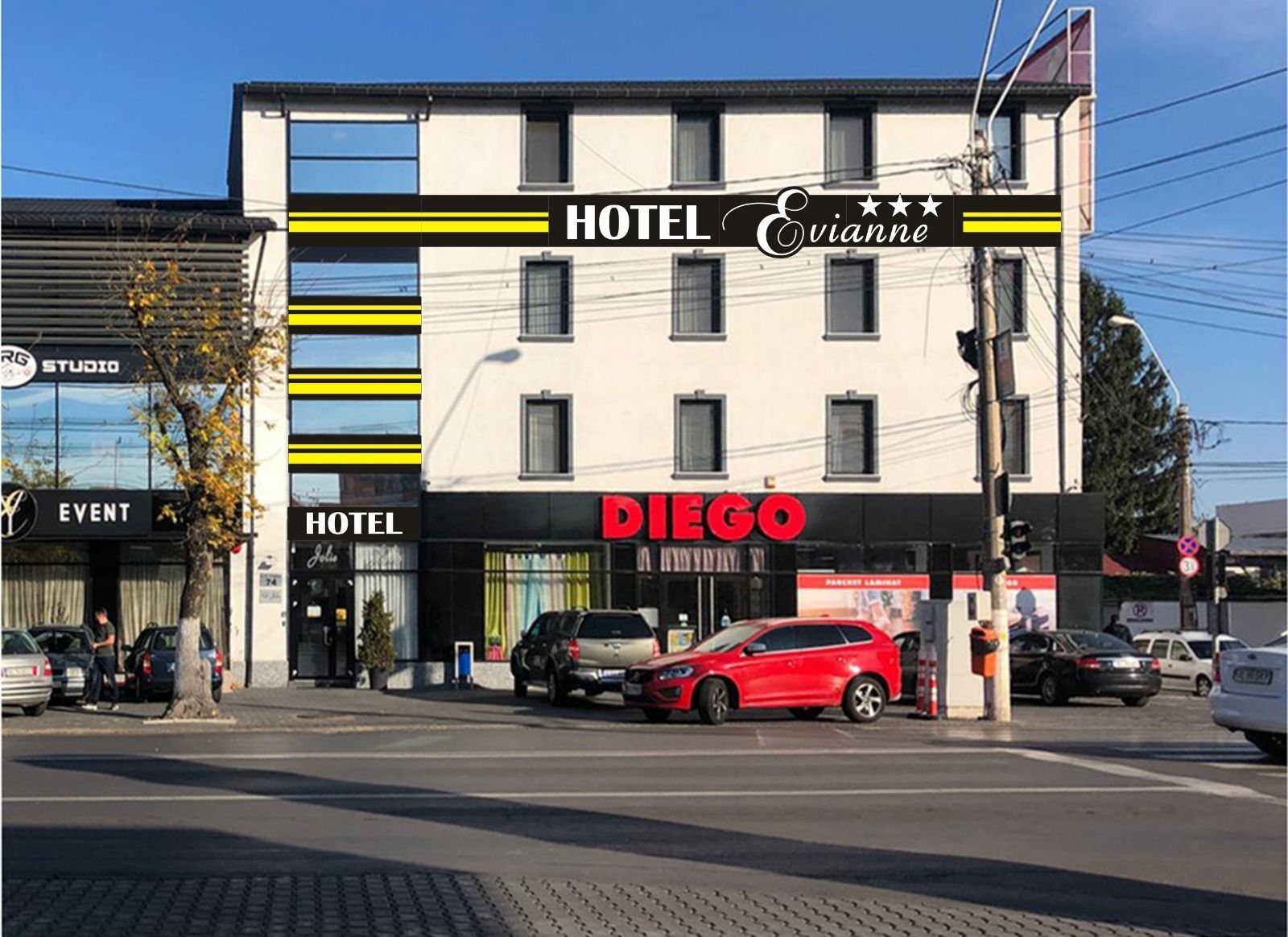 A hotel named DIEGO with a modern facade, multiple windows, and a visible entrance.