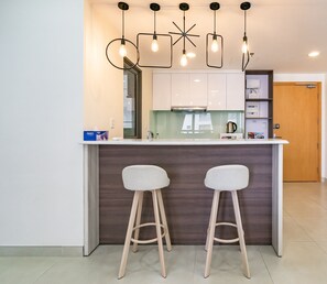 Deluxe Apartment, 2 Bedrooms | Private kitchenette | Full-sized fridge, microwave, stovetop, electric kettle - Halo Hola Apartment at Masteri Thao Dien (Ho Chi Minh City)