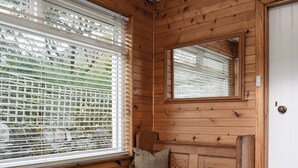 A wooden interior with a bench, a book, and a glass of wine. - 3 bedroom accommodation in Fortingall, near Aberfeldy (Fortingall, near Aberfeldy)