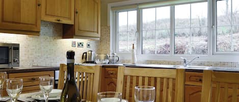 Convenient dining area within kitchen | Woodland View 2 - Plas Talgarth, Pennal, near Machynlleth