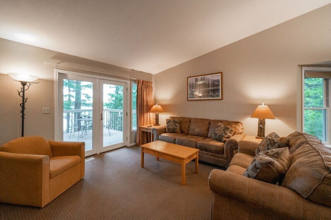 Deluxe Condo, Lake View, Lakeside | Living area | 32-inch TV with cable channels, DVD player