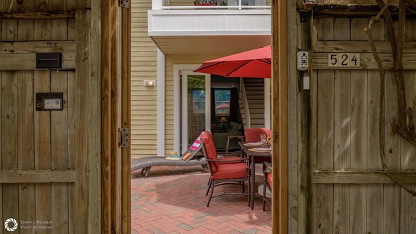A wooden door with a number plate '524' and a plaque indicating a 'City of Key West' award. - **SWEET AMERICANA** 8BR/8BA Compound & 2 Pools + Last Key White Glove Service... (Key West)