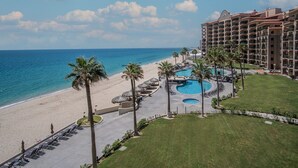 A resort with a beach, a pool area, and a multi-story building. - Sonoran Sea E-401 Feeling tip' Sea In Paradise Bright Oceanfront Condo (Puerto Peñasco)