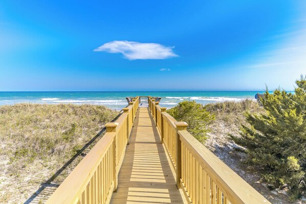 A wooden boardwalk leading to a beach with clear skies. - Misty Morning North - 4BR Oceanfront Home; Dog Friendly! (North Topsail Beach)