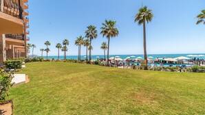 A resort with a swimming pool, palm trees, and a view of the ocean. - Sonoran Sea E-108 Sea-Gem Spectacular Spacious Oceanfront Condo (Puerto Peñasco)