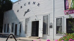 A white building with the name "GRUENE Hall" on the facade.